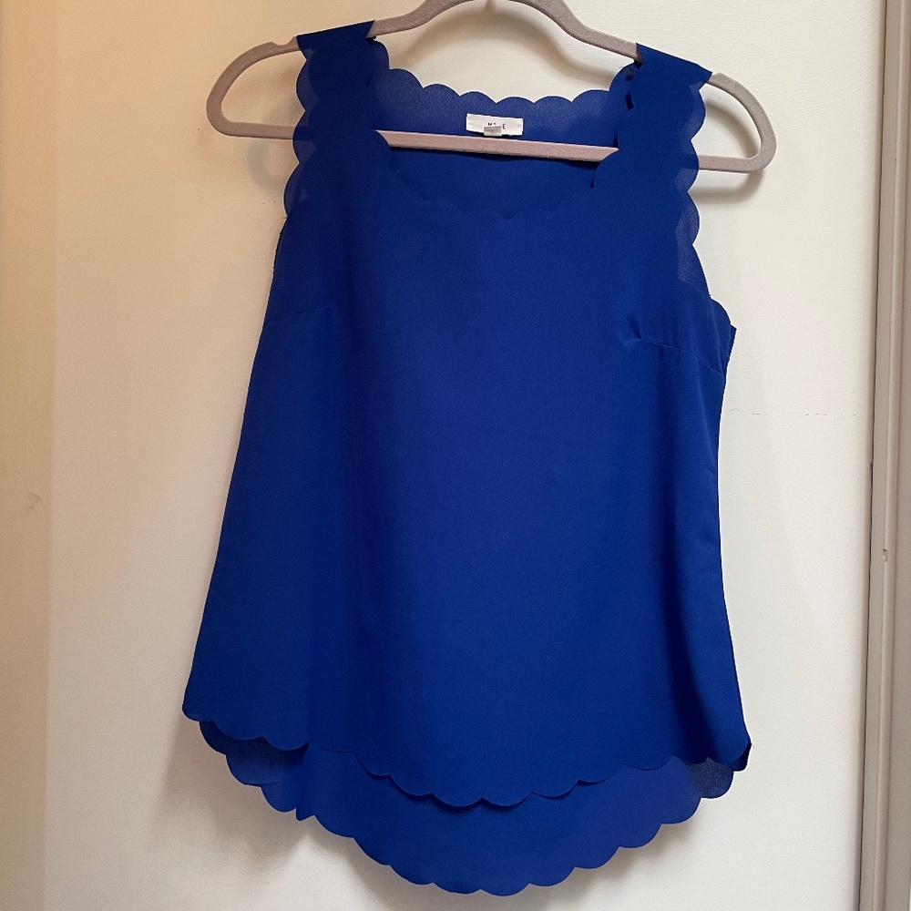 Scallop edge tank